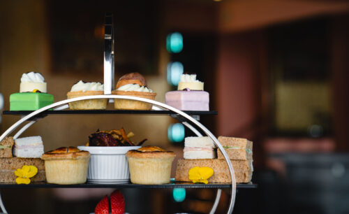 classic afternoon tea in the lake district with patisserie, scones and warm savory treats