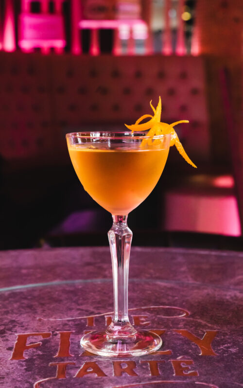Valentine's cocktails with orange garnish